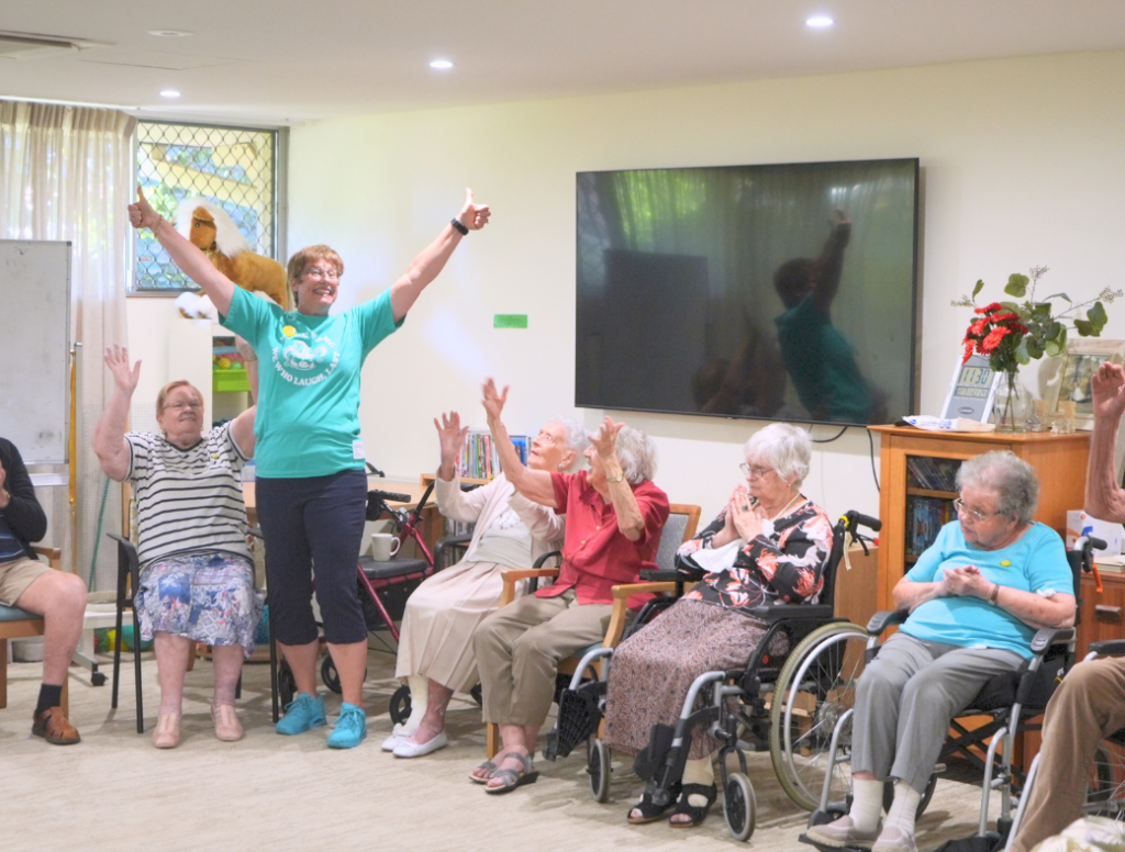 Janni Goss running a Laughter Yoga class